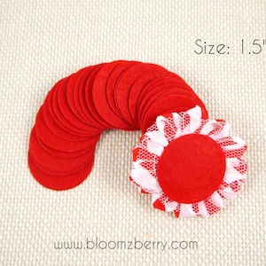 May include: A pile of 1.5 inch red felt circles with a red felt circle with white lace trim on top. Size: 1.5"