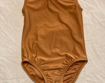 May include: A brown sleeveless leotard with a scoop neck.