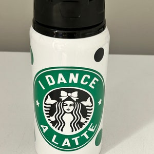 May include: White water bottle with a green and black Starbucks-inspired logo that says "I Dance A Latte" and black polka dots.