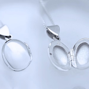 925 Solid Sterling Silver Oval Locket Necklace 925 Sterling Silver Necklace Small Oval locket Size .59&quot;x.47&quot;. Ref 9