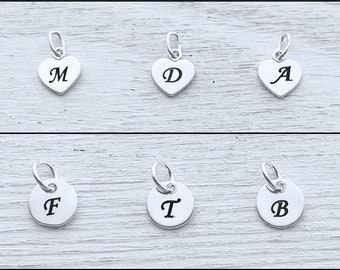 Add Laser engrave initial . Sizes: 7-8 mm.  Sterling silver initial Disc OR Heart.