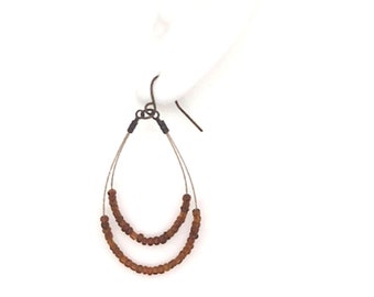 Vintage teardrop shaped beaded earrings : bronze tone wire & amber tone beads ; 2 inches