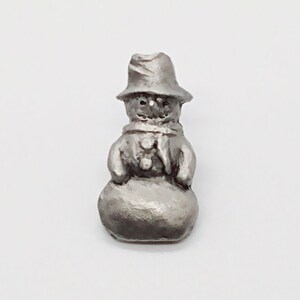 Vintage small silver tone metal snowman pin badge tie tack with top hat, scarf, and buttons ; about 1 x 1/2 in.