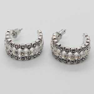 Vintage Thai flower pattern round hoop earrings : light and dark silver tones with dark stones ; about 3/4 inches long