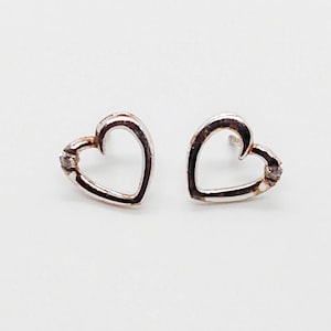 Vintage Chinese sterling silver heart shaped pierced earrings with small silver tone stone in upper corner ; about 3/8 in.