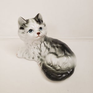 Vintage Cat Figurine White and Black Cat Laying Down Has Blue Eyes Porcelain Ceramic Figure