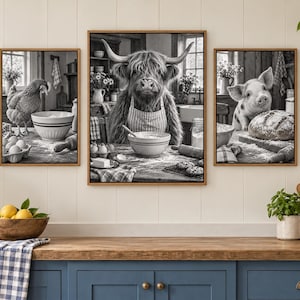 May include: A set of three black and white framed wall art prints depicting a chicken, a Highland cow, and a piglet in a kitchen setting. Each animal is shown interacting with baking ingredients like bowls, flour, and dough on a wooden table.