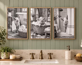 May include: A set of three framed black and white wall art prints featuring a piglet in a bathroom setting. The first shows a piglet with a towel, the second a piglet in a metal tub, and the third a piglet peeking from behind a shower curtain.