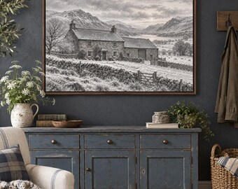 May include: A framed black and white landscape print depicting a stone farmhouse with a slate roof, a stone wall, and a wooden gate in a mountainous valley. The scene includes a lake in the distance under a cloudy sky, presented in a brown frame.