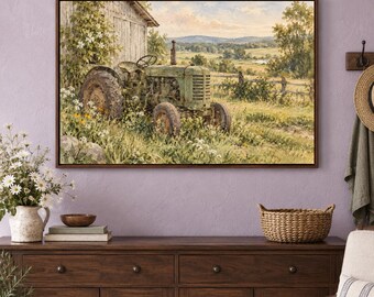 May include: A framed landscape painting depicting a weathered green tractor parked beside a rustic wooden barn in a grassy field filled with wildflowers, with rolling hills and a soft sky visible in the background of the rural scene.