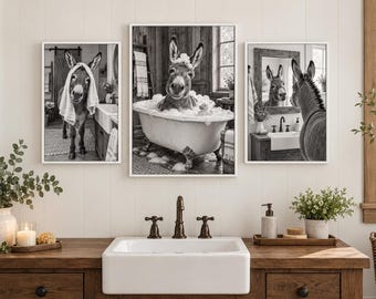 May include: A set of three black and white wall art prints featuring a donkey in a bathroom setting. The left print shows a donkey with a towel on its head, the center shows a donkey in a bubble bath, and the right shows a donkey looking in a mirror.