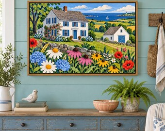 May include: A framed landscape painting depicting a white two-story house with blue shutters, a stone wall, and a garden filled with red poppies, white daisies, and blue hydrangeas, set against a backdrop of rolling green hills and the blue sea.
