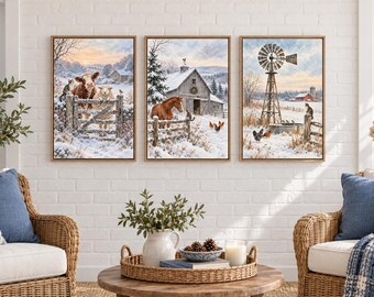 May include: A set of three framed wall art prints depicting winter farm scenes. The first shows a cow and sheep by a gate, the second a horse near a barn, and the third a windmill with chickens in a snowy landscape with light wood frames.