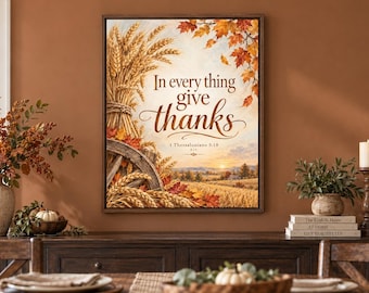 May include: A rectangular framed wall art print featuring a golden wheat sheaf, a wooden wagon wheel, and autumn leaves. The text reads In every thing give thanks 1 Thessalonians 5:18 KJV over a sunset landscape of a field.