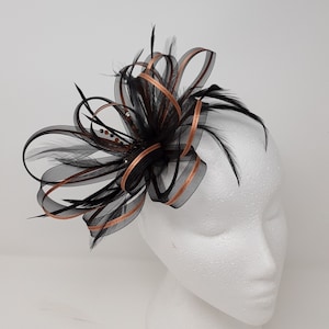 Black and copper fascinator with a touch of sparkling diamantè on clip, comb and Alice band.