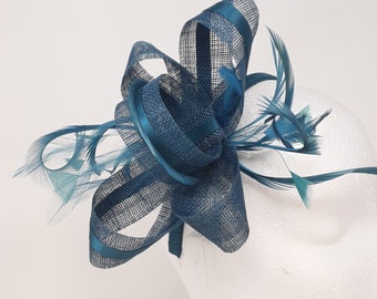 Teal fascinator with ribbon and feathers on a clip, comb and Alice band