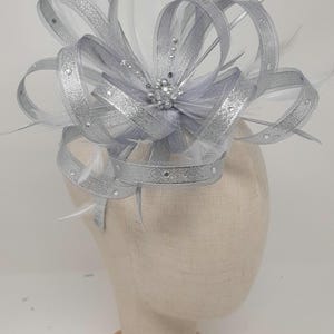 Metallic silver fascinator with centre bead cluster on comb, Alice band or clip.