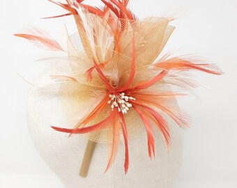 Nude and burnt orange fascinator attached to clip, comb and Alice band