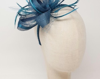 Teal fascinator with ribbon and feathers on a clip, comb and Alice band