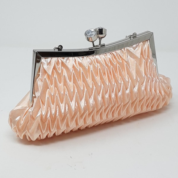 Peach  satin clutch bag with  rhinestone detail.