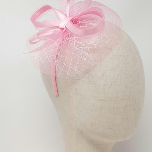 Pale pink dainty fascinator attached to clip, comb and Alice band