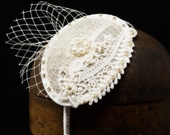 Ivory lace, pearl and crystal bridal wedding fascinator.