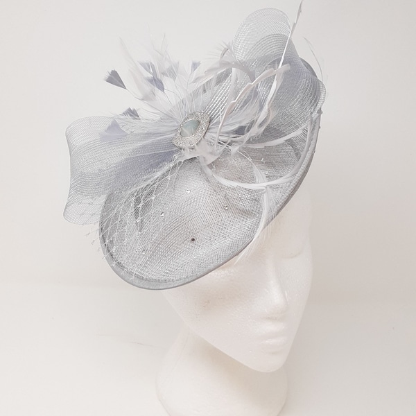 Silver shimmer hatinator style fascinator with art deco inspired brooch on a clip, comb and Alice band