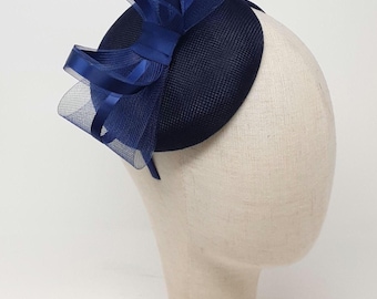 Navy blue button percher style fasinator on a clip, comb and Alice band