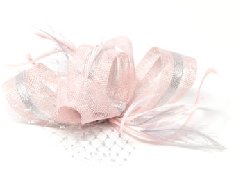 Blush pink fascinator with silver accent ribbon and feathers on a clip, comb and Alice band.