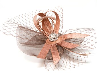 Metallic rose gold fascinator with diamantè brooch on a clip, comb and alice band