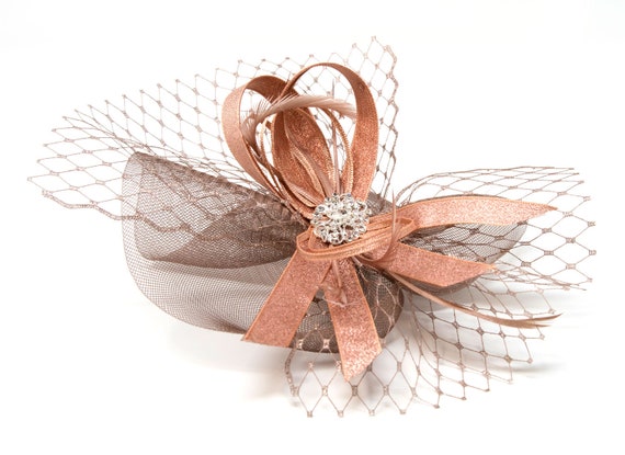 Metallic gold fascinator with diamantè and bead cluster on an alice band