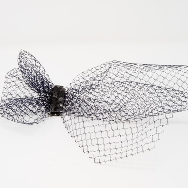 Black french veil fascinator on a clip.