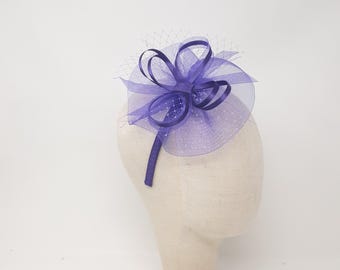 Purple dainty fascinator attached to clip, comb and Alice band