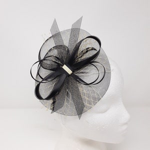 Dainty black and gold fascinator attached to clip, comb and Alice band