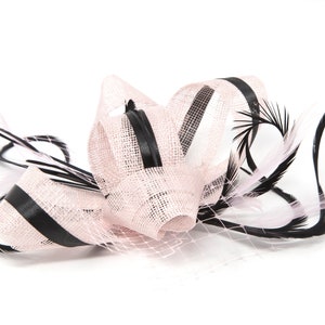 Blush pink fascinator with black accent ribbon and feathers on a clip, comb and Alice band