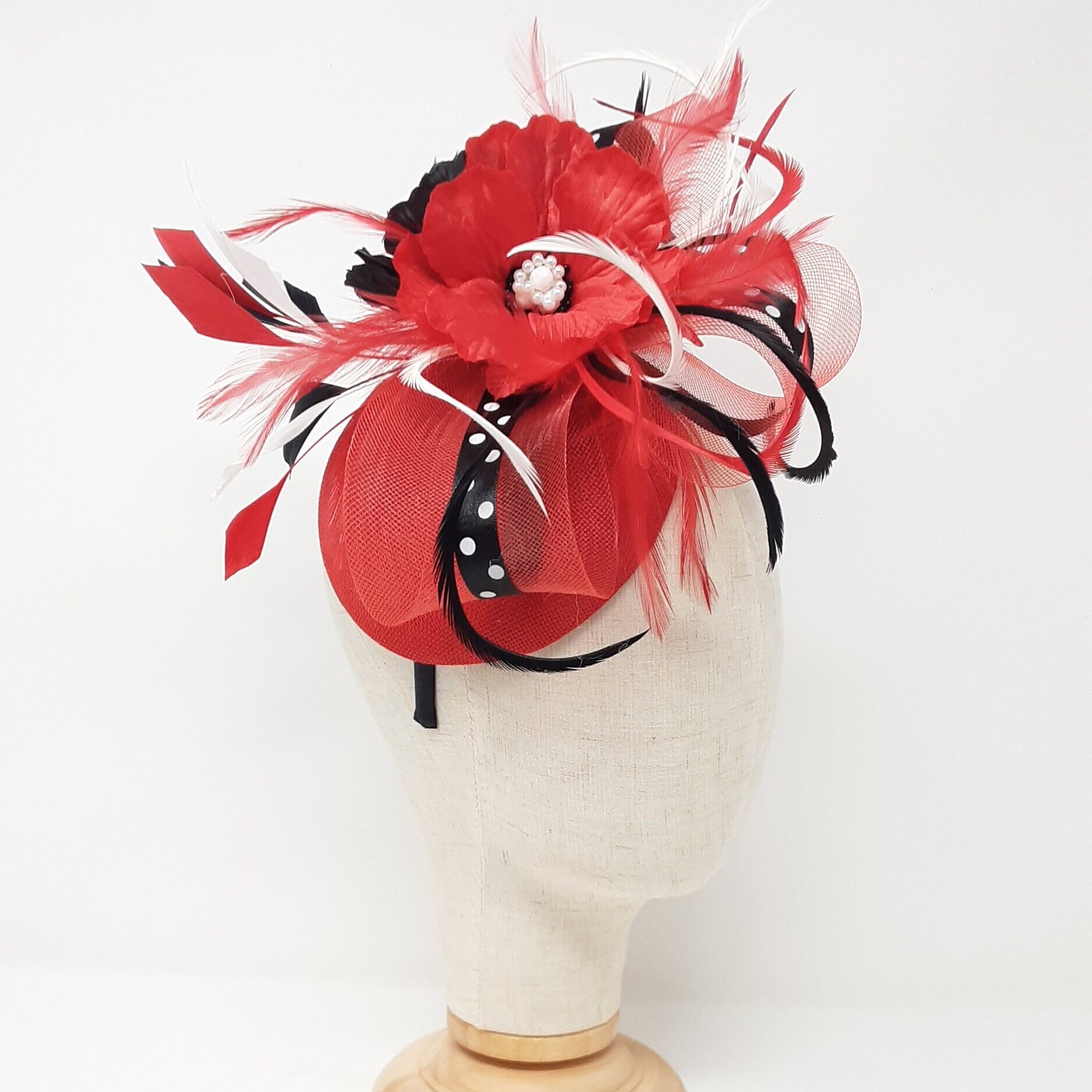Red, black and white polka dot poppy hatinator or percher fascinator.