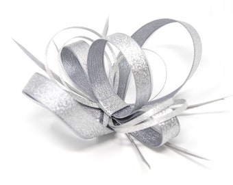 Metallic silver fascinator with comb, clip, & alice band.