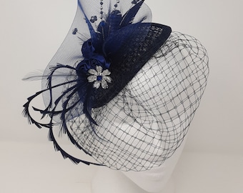 Navy blue and silver fasinator with veiling and beautiful bead detail.