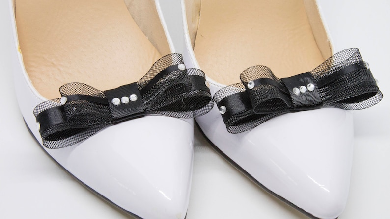 Black and sparkling diamant\u00e8 shoe clips