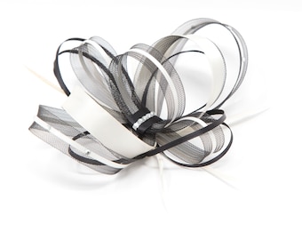 Ivory and black fasciantor with a touch of sparkling diamanté on a clip …