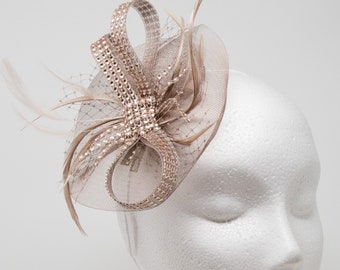 Rose gold shimmer fascinator attached to a clip