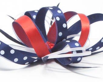 Navy blue, red and white polka dot fascinator with comb, clip, & alice band.