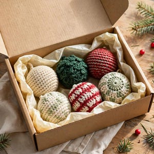 Kraft gift box with handmade crocheted Christmas ball ornaments nestled in tissue paper as a holiday gift set