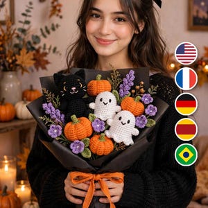 May include: A crochet bouquet wrapped in black paper with an orange ribbon, featuring a black cat, two white ghosts, four orange pumpkins, and purple flowers. The arrangement is crafted with yarn and includes various decorative botanical elements.