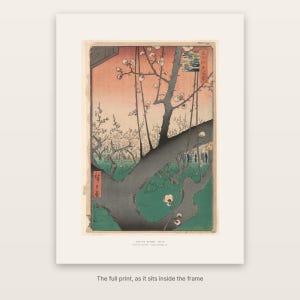 The full print of Hiroshige's Plum Park in Kameido with its washi-tone margin and caption, as it sits inside the frame