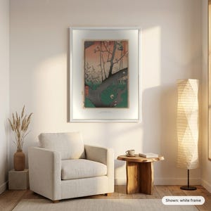 Hiroshige's Plum Park in Kameido in a white frame on a living room wall