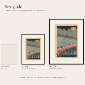 Size comparison of the 12x16 and 18x24 inch framed prints next to a sheet of letter paper