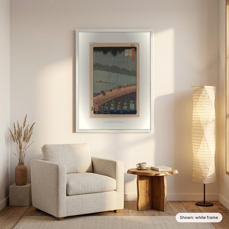 Hiroshige's Sudden Shower in a white frame on a living room wall