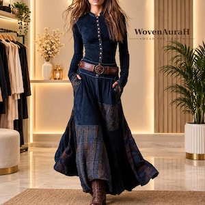 May include: A long-sleeved navy blue dress featuring a button-down bodice, a brown leather belt with a circular buckle, and a skirt with mixed solid and plaid fabric panels. The text WovenAuraH WEAR THE CRAFT is visible in the upper right corner.