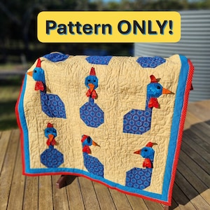 May include: A handmade quilt with a repeating pattern of blue and red bird appliqués on a tan background. The quilt is bordered with blue and red fabric and has the text "Pattern ONLY!" in a yellow banner.